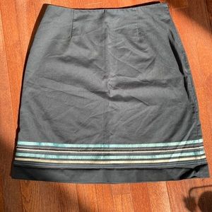 Russell Kemp black vintage skirt with fabric sewn stripes along the bottom.